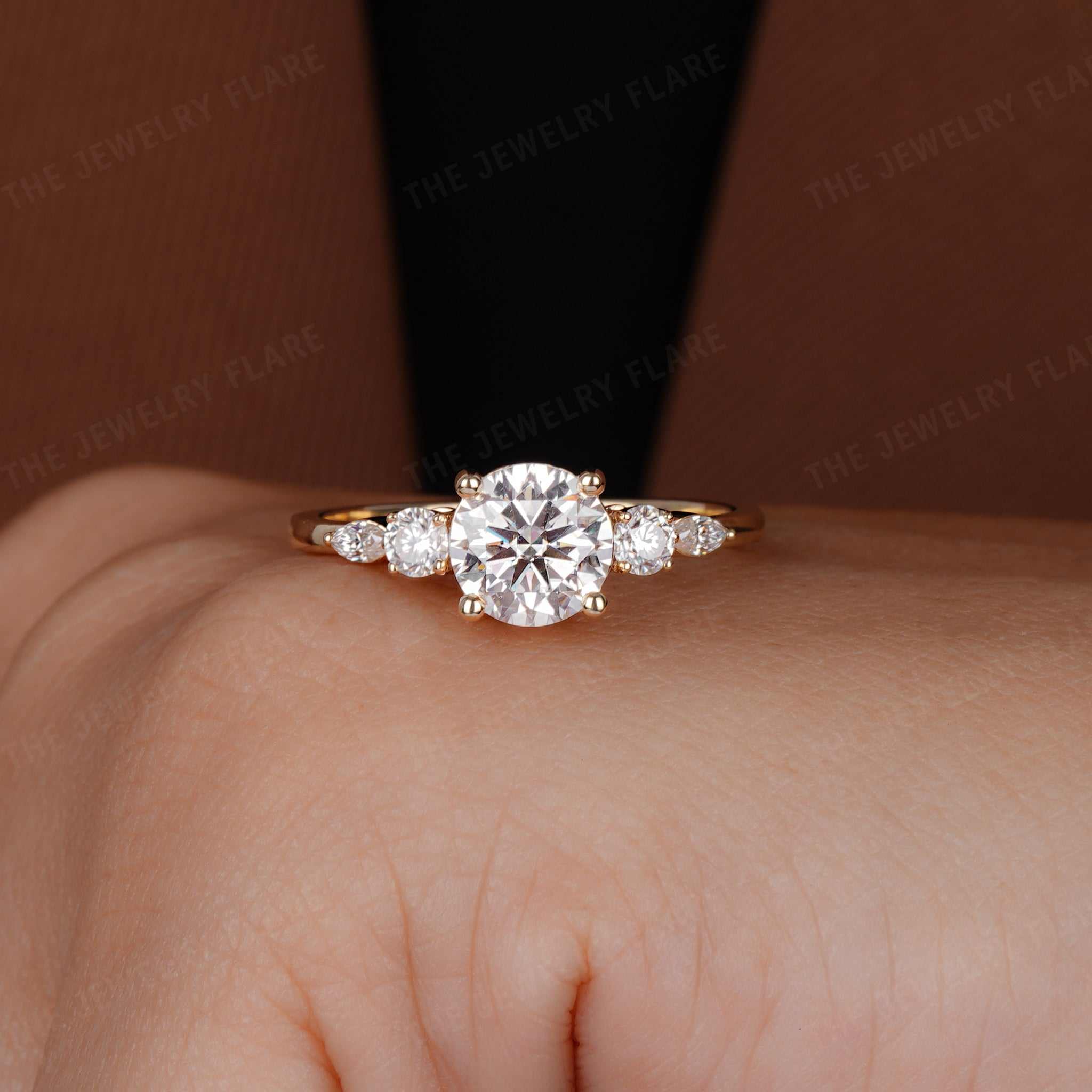 Round Solitaire Ring With Side Marquise Accent