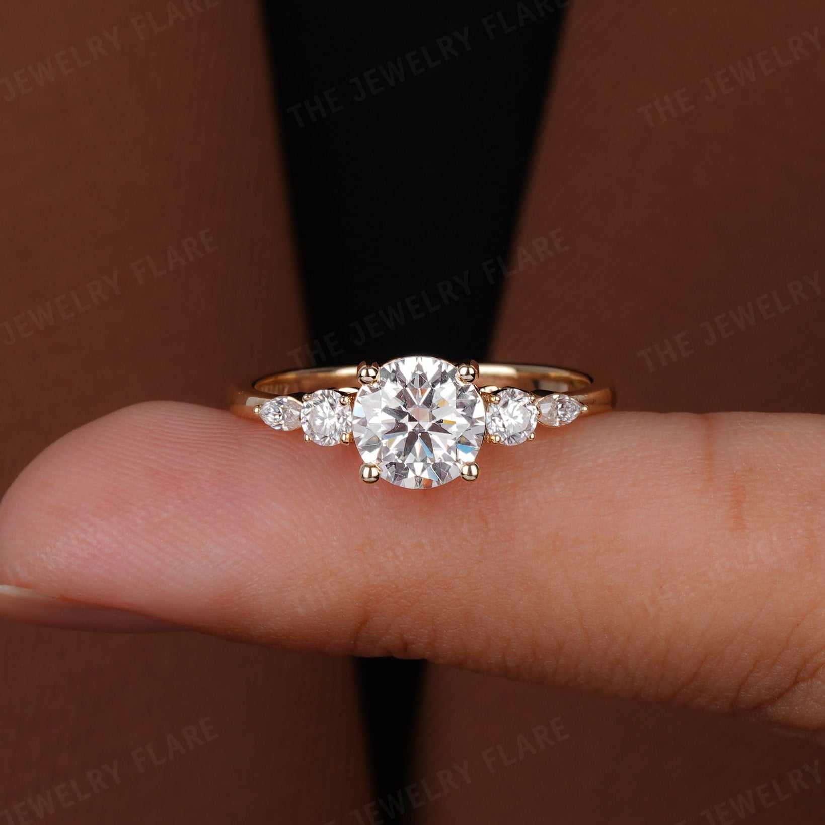 Round Solitaire Ring With Side Marquise Accent