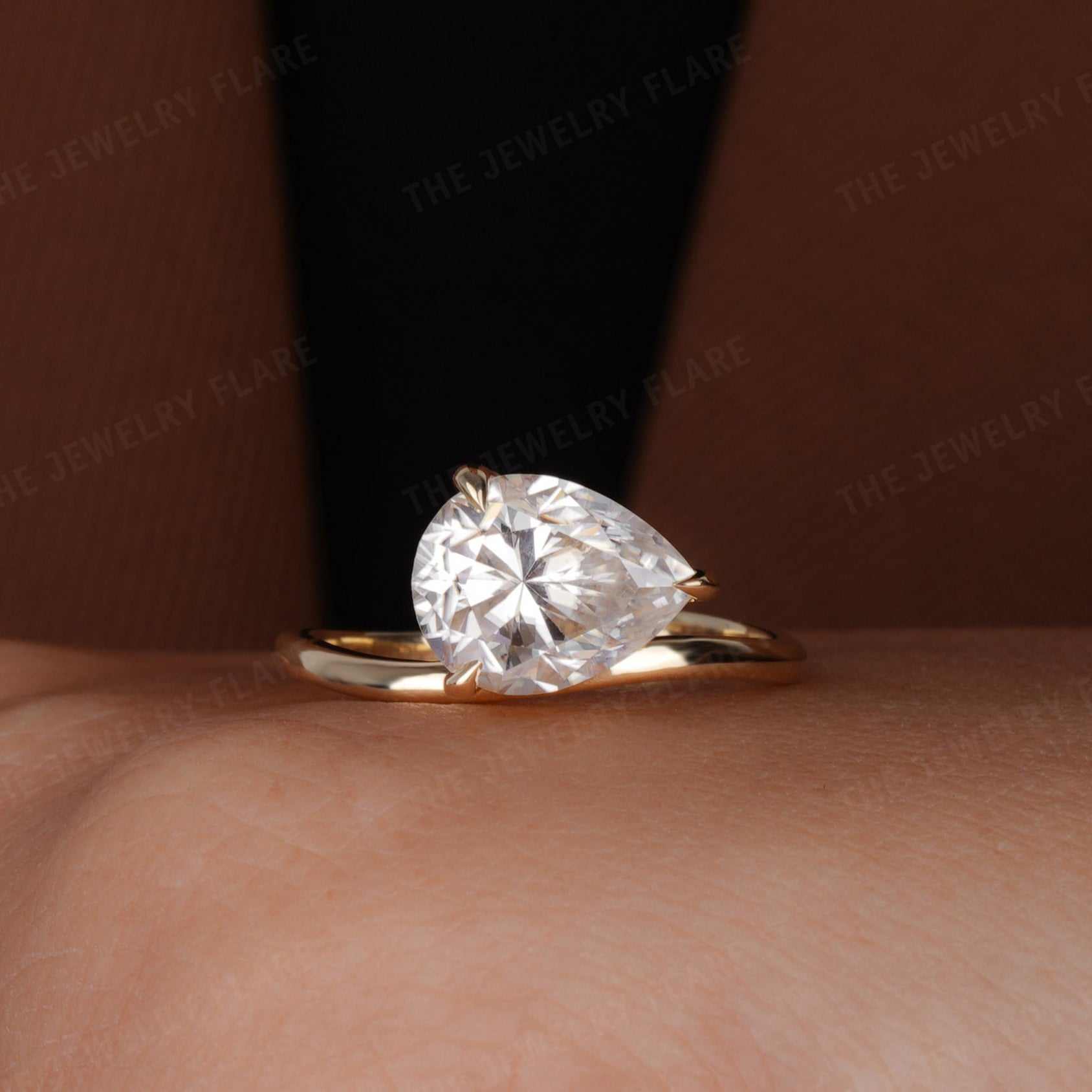 Curve Shank Pear Cut Solitaire Ring