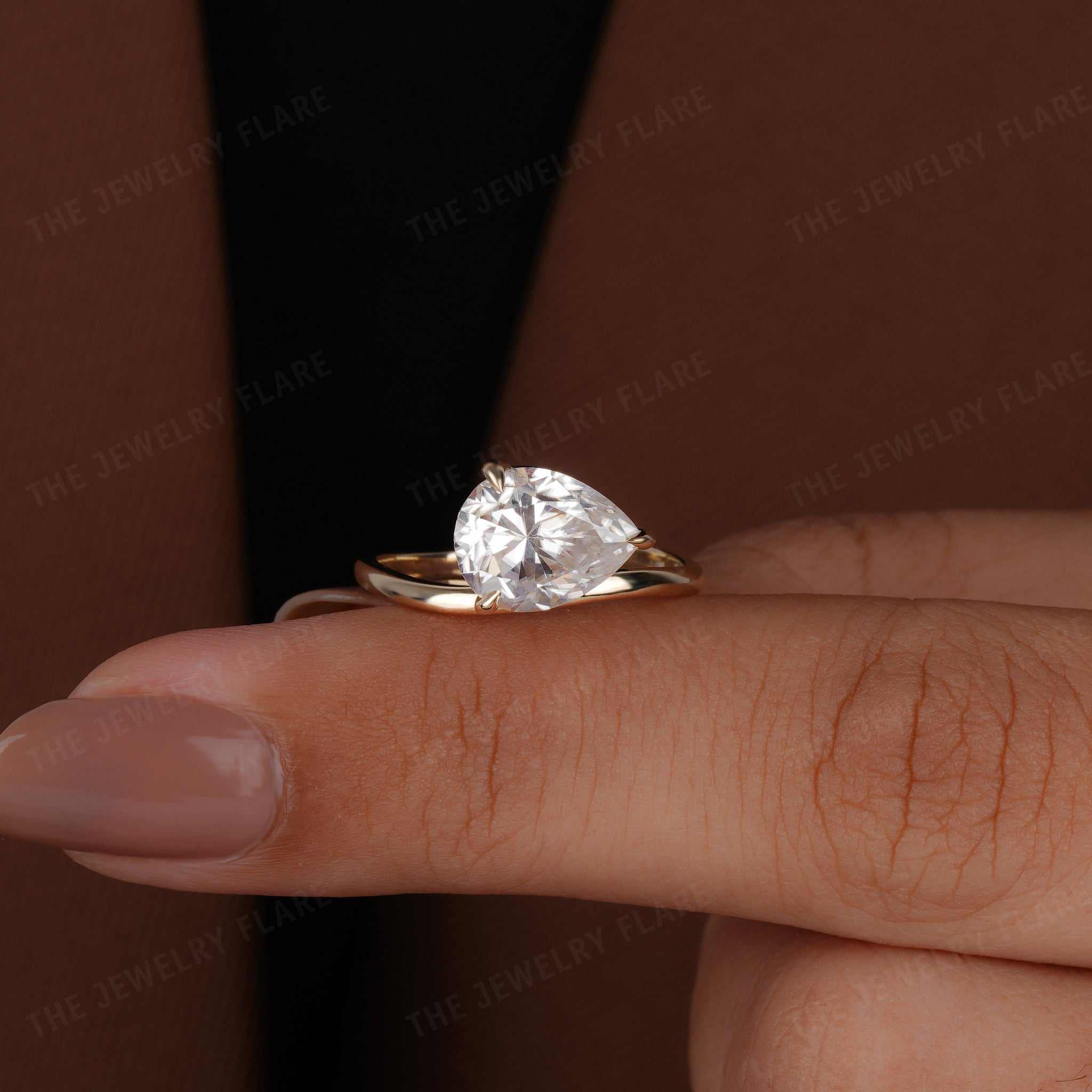 Curve Shank Pear Cut Solitaire Ring