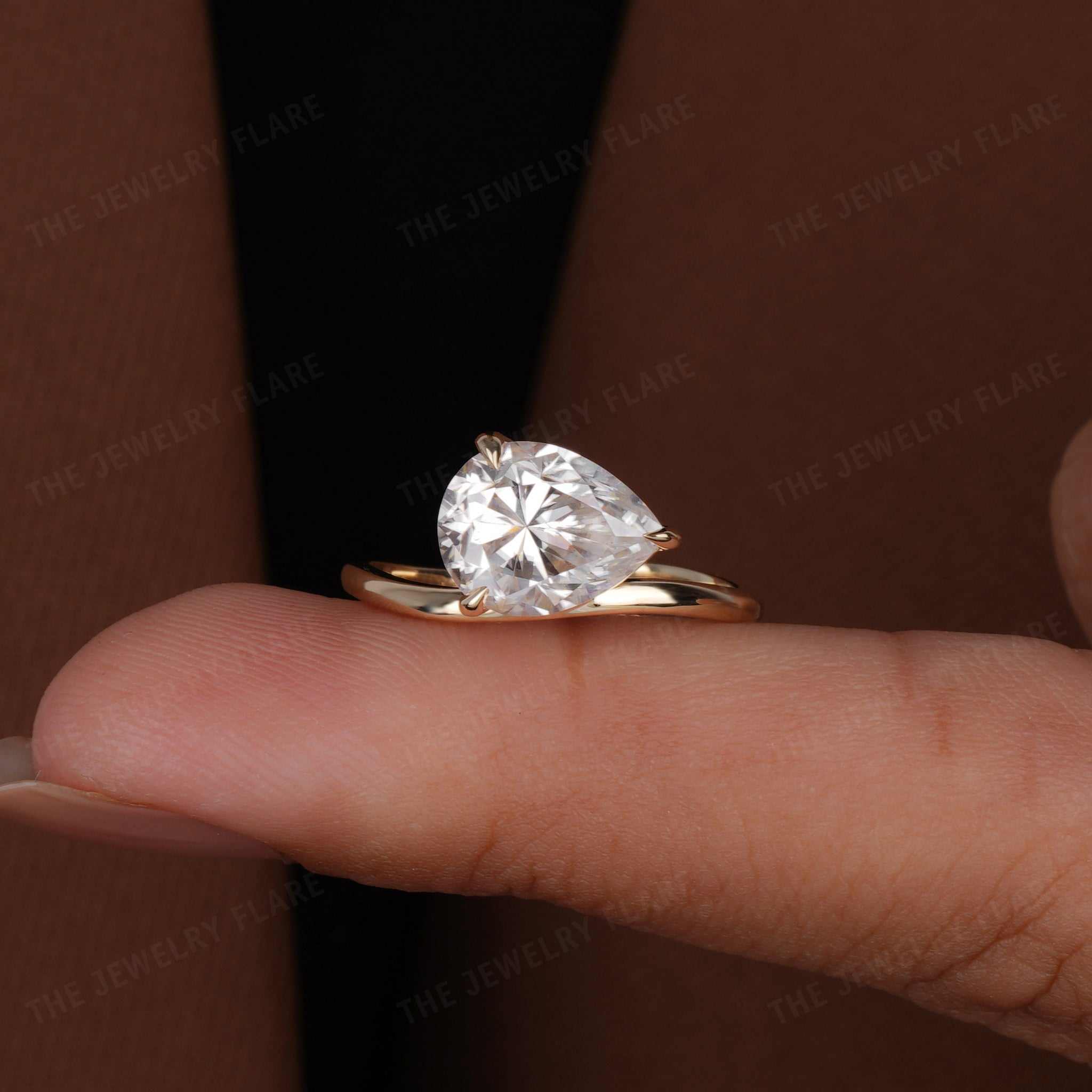 Curve Shank Pear Cut Solitaire Ring