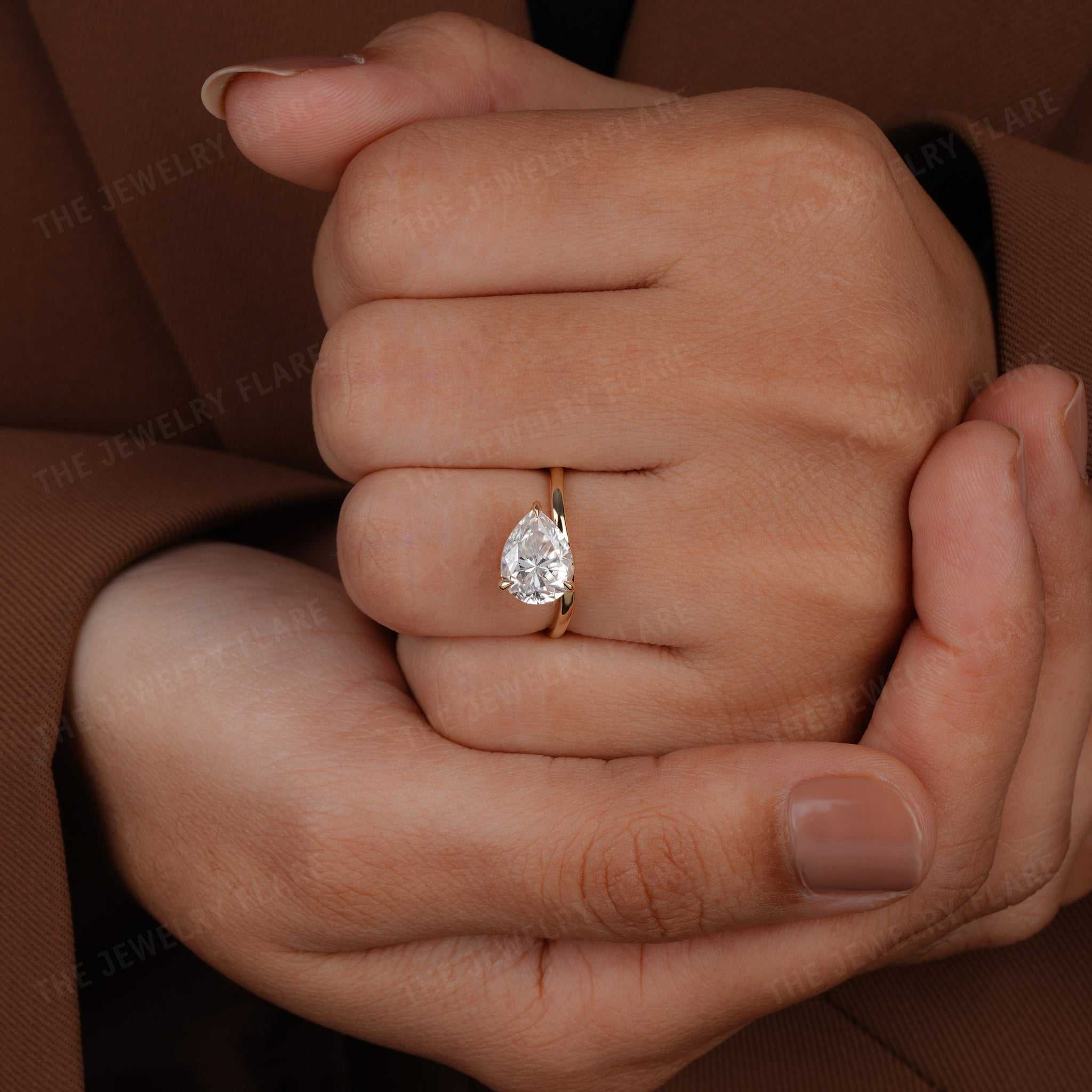 Curve Shank Pear Cut Solitaire Ring