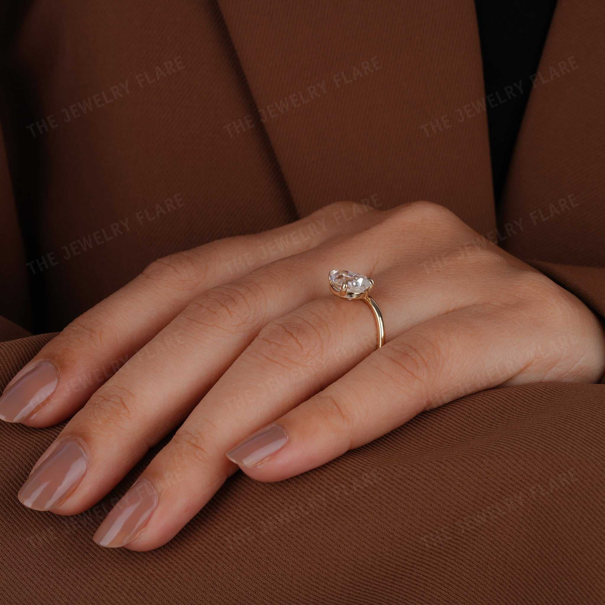 Curve Shank Pear Cut Solitaire Ring