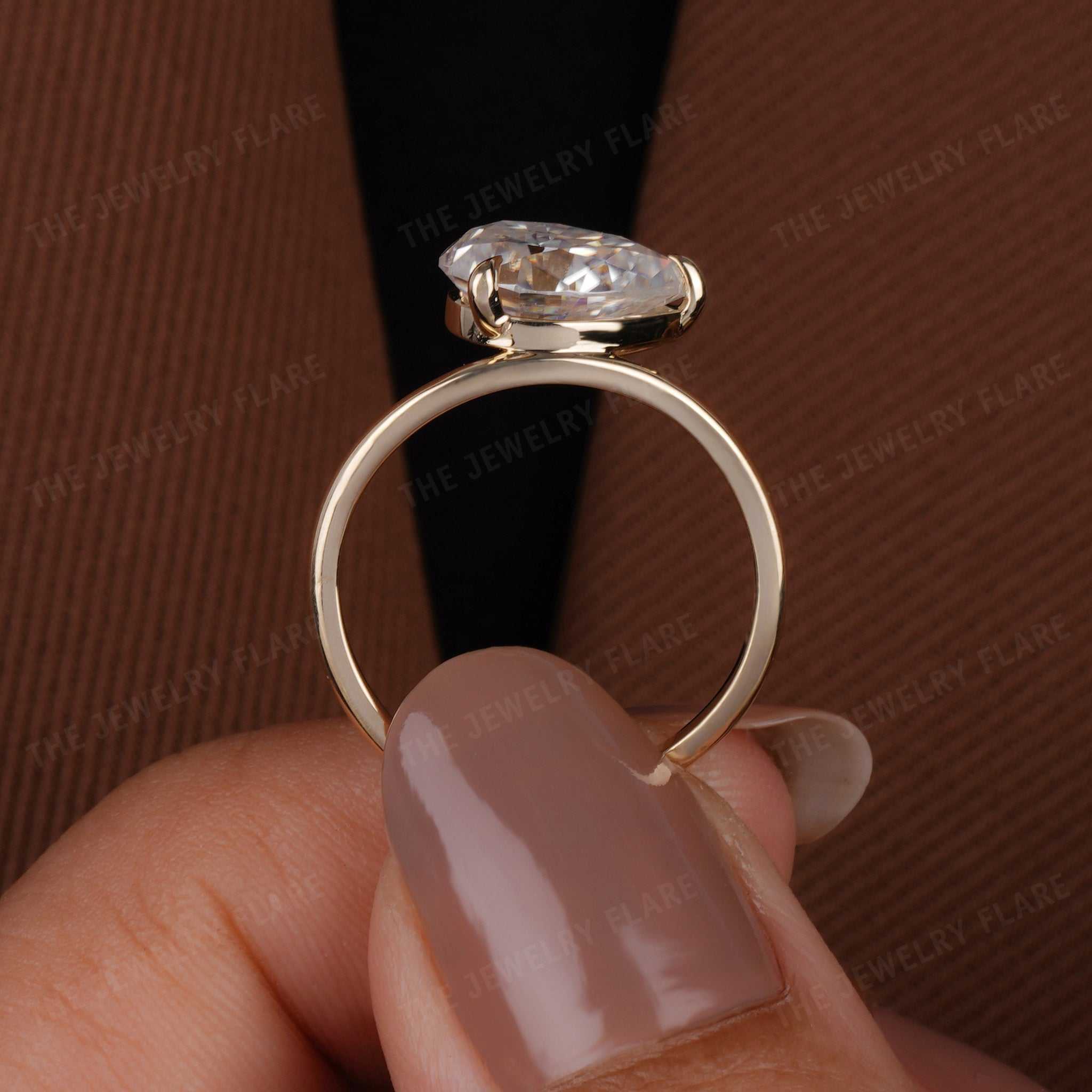 Curve Shank Pear Cut Solitaire Ring