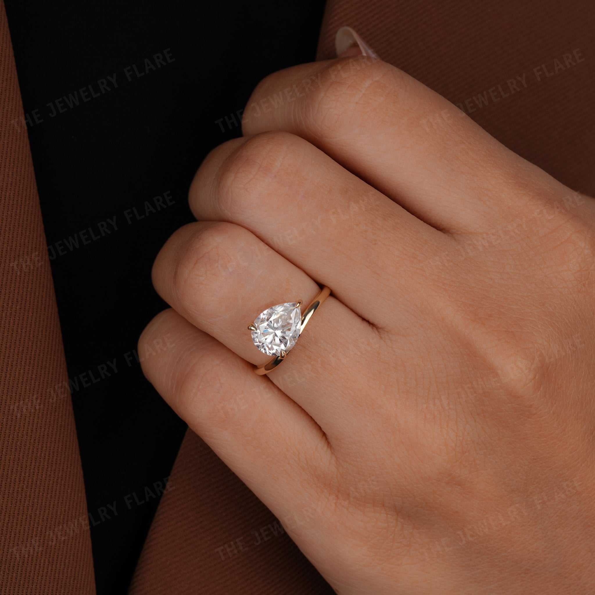 Curve Shank Pear Cut Solitaire Ring
