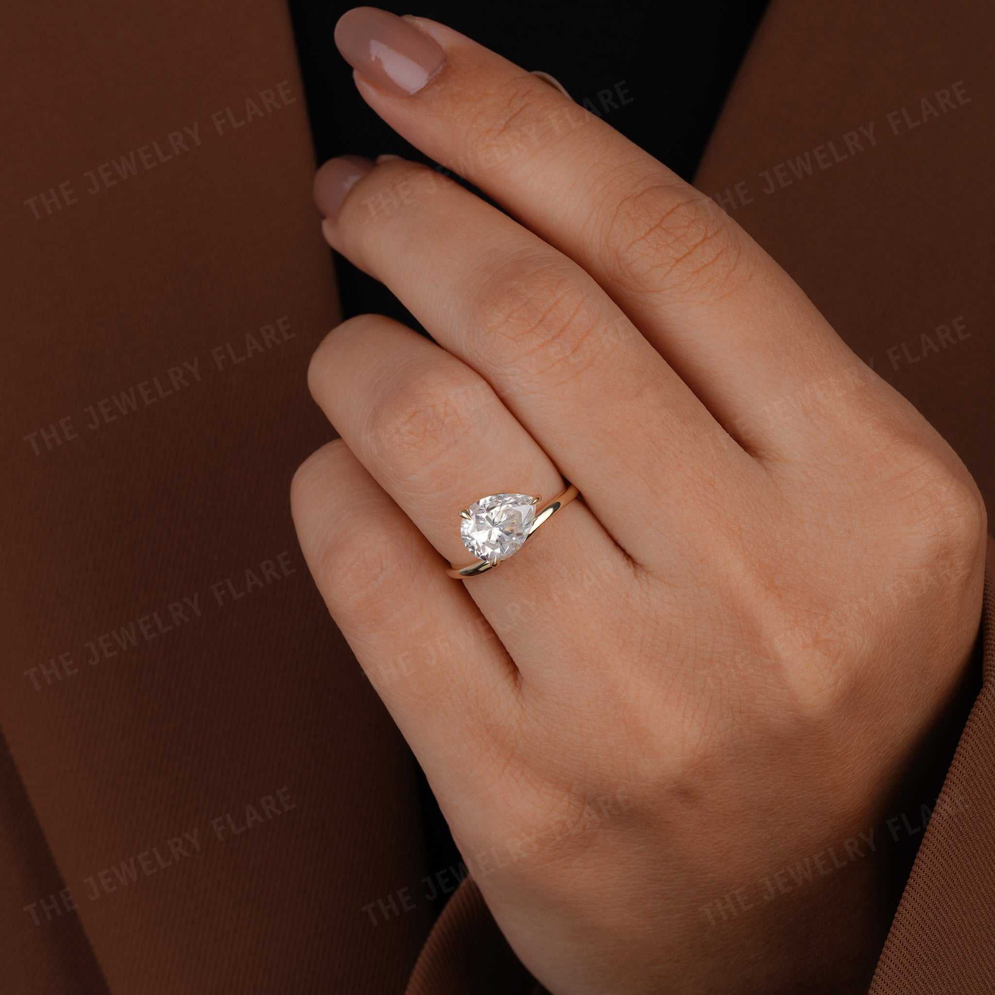 Curve Shank Pear Cut Solitaire Ring